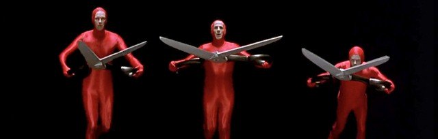 guys in red bodysuits with scissors