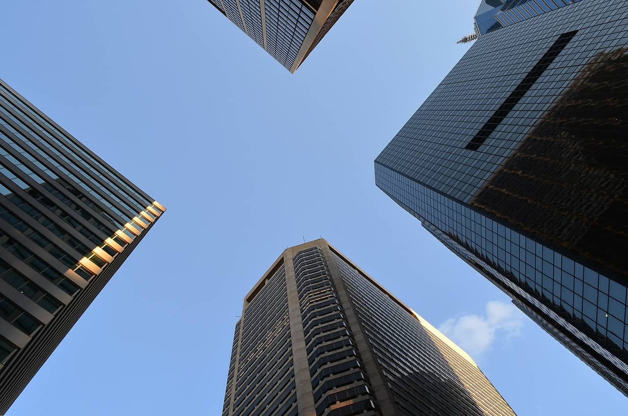 A photograph looking upward at four skyscrapers in Philadelphia. 