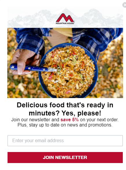 Mountain House exit discount pop-up. Under a photograph of a person eating a bowl of food outdoors, text states: Delicious food that's ready in minutes? Yes, please! Join our newsletter and save 5% on your next order. Plus, stay up to date on news and promotions. Below a text field states: Enter your email address. Below the textbox a button is labeled Join Newsletter.