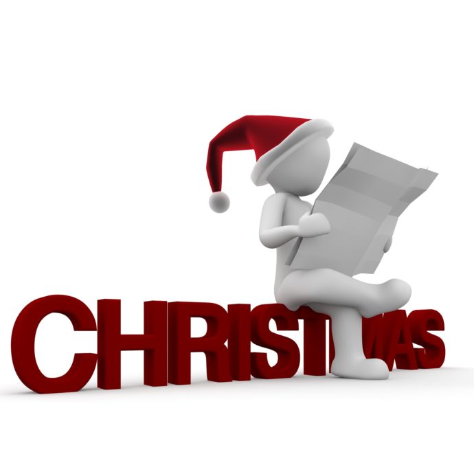 santa sitting on christmast letters reading