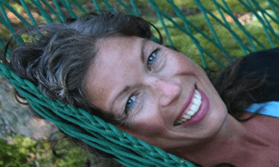 A photograph of Christina Griggs in a hammock.