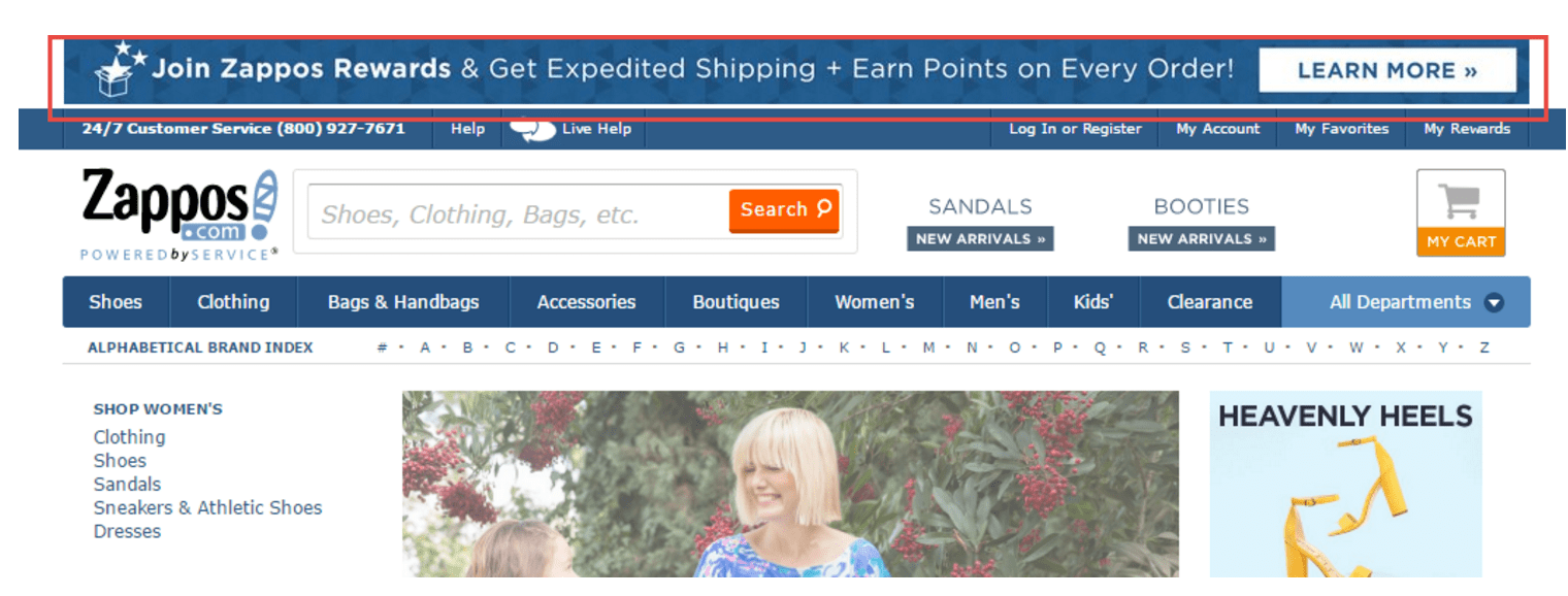 Zappos desktop website. A narrow banner at the top above the menu with the text: Join Zappos Rewards & get expedited shipping plus Earn points on every order! Button labeled Learn more.  