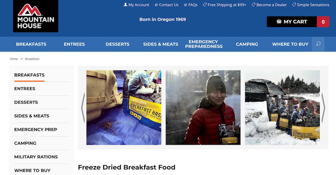 Mountain House Freeze Dried Breakfast food page screenshot. Beneath the top menu bar, a carousel of photographs from Instagram users. First is a bag of Breakfast hash on a tarp outdoors with a spider next to it. Second is a person in cold weather gear holding a Mountain House product outdoors. Third is three bags of Mountain House products lined up in a row in the snow with a tent in the background. 