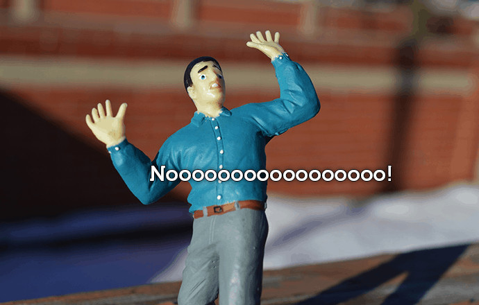 A photograph of a figurine of a man panicking. Text states: noooooo!