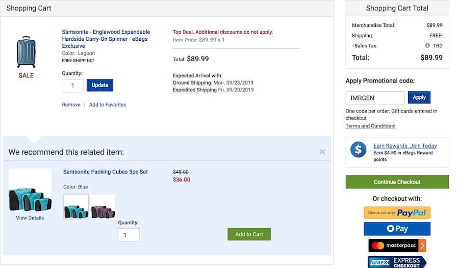 ecommerce-upselling-14 Ebags pre-checkout screenshot. At the top left a section titled shopping cart containing a Samsonite suitcase. Below, a section titled "We recommend this related item:" followed by Samsonite Packing Cubes. On the right is the shopping cart total.