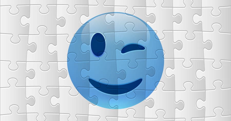 An illustration of a puzzle of a smiley face winking. 