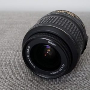 A photograph of a Nikon lens. 