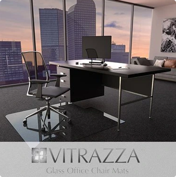 A photograph of a glass chair mat in an office setting. Logo: Vitrazza Glass Office Chair mats. 