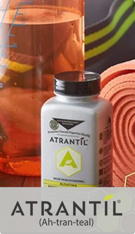 A photograph of an Atrantil bottle with a glass container with measurement lines and a yoga mat in the background. Logo: Atrantil (Ah-tran-teal).  