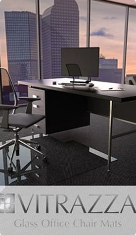 A photograph of a glass chair mat in an office setting. Logo: Vitrazza Glass Office Chair mats. 