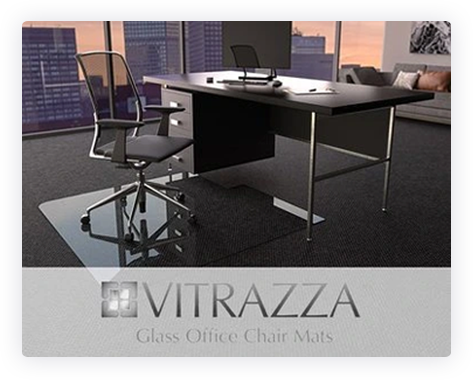 A photograph of a glass chair mat in an office setting. Logo: Vitrazza Glass Office Chair mats. 