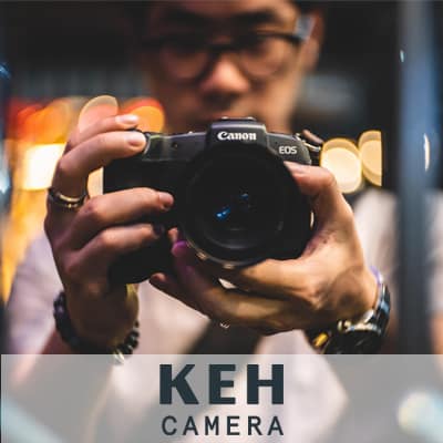 K E H Camera Case Study. A photograph of a man holding a camera. 