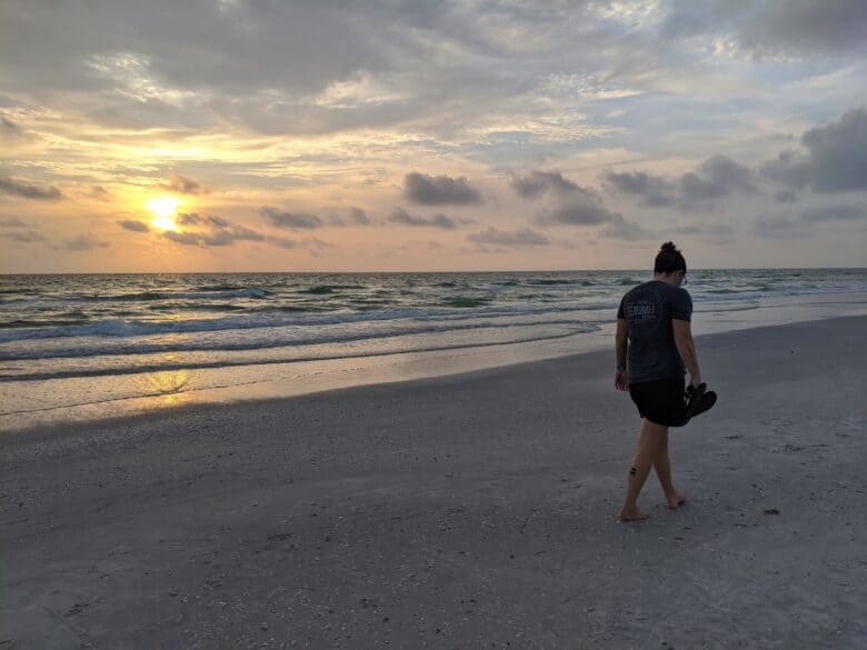 Jen Holzman walking on the beach