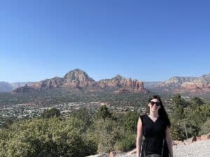 Julia Morris standing in front of mountains in Arizona.