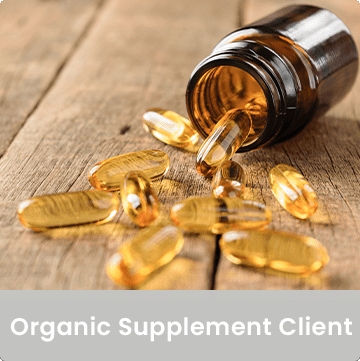 Organic Supplement Client. Image of gel capsules spilling out of glass bottle.