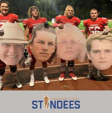 Football players holding cardboard cutouts of their own faces. Logo: Cardboard Cutout Standees.