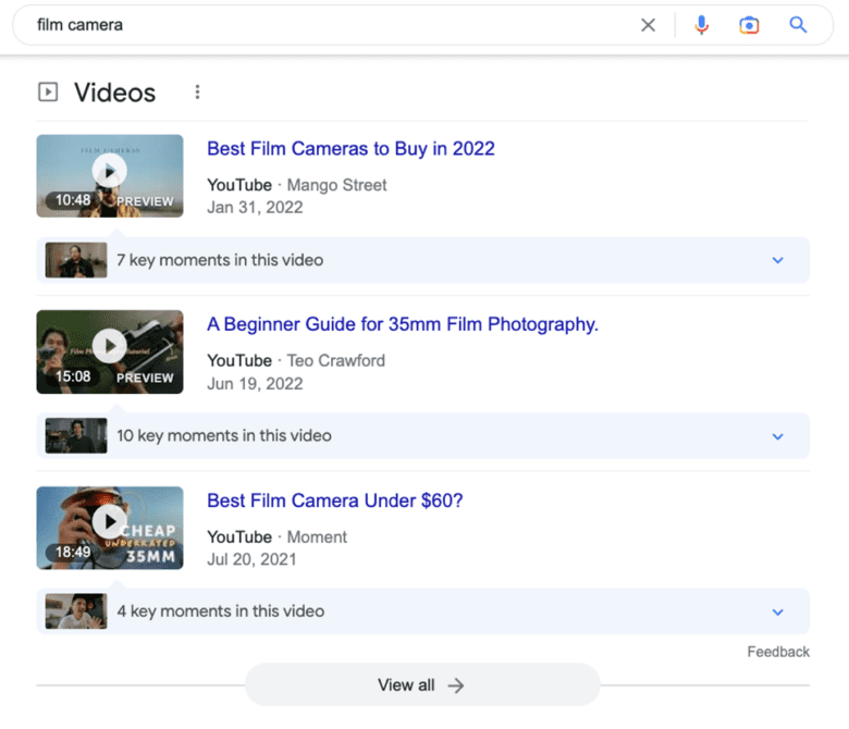 Google search results for "film camera." Video titles: "Best Film Cameras to Buy in 2022." "A Beginner Guide for 35mm Film Photography." "Best Film Camera Under $60?"