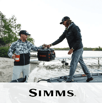 A man on a boat passes a Simms-branded cooler to another on shore. Logo: Simms Fishing Products.